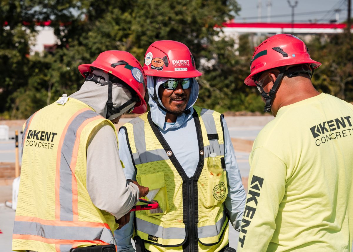 Safety team collaborating on ipad on construction site